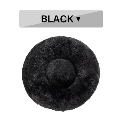 Plush calming donut dog bed, black studio shot